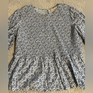 Blue and white floral smocked peplum blouse.